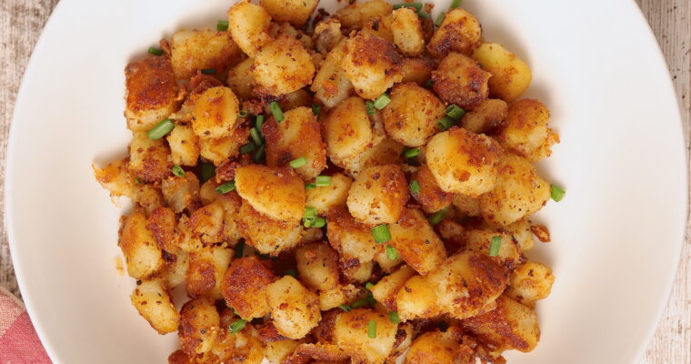 A plate of crispy skillet breakfast potatoes.