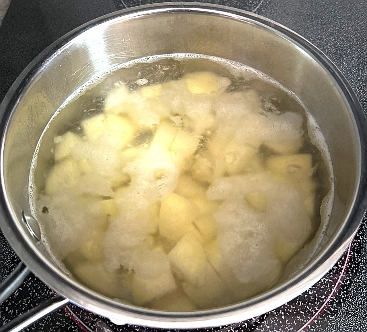 Parboiling potatoes for a breakfast hash.