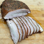 Juicy Smoked Texas-Style Smoked Turkey Breast slices.