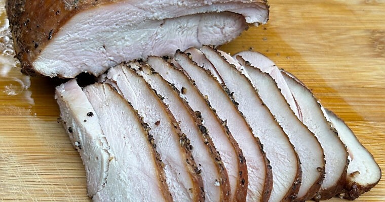 Juicy Smoked Texas-Style Smoked Turkey Breast slices.